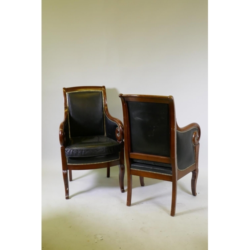 1014 - A pair of French Empire style mahogany framed armchairs, upholstered in leather