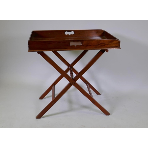 1017 - An antique mahogany butler's tray with folding stand, 78 x 49 x 9cm