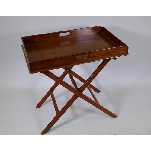 1017 - An antique mahogany butler's tray with folding stand, 78 x 49 x 9cm