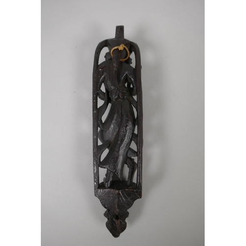 102 - An Indian carved wood figure, 27cm high