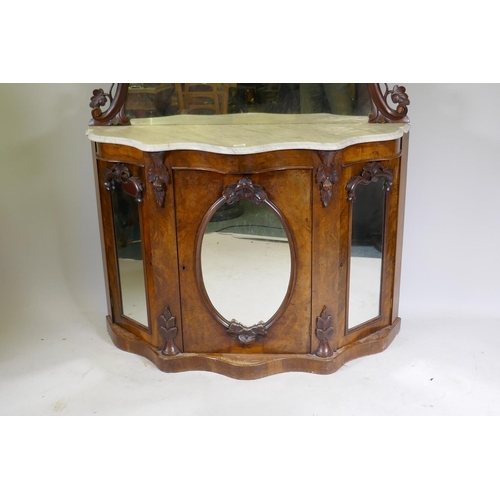 1020 - A Victorian mirror back chiffonier, the serpentine shaped base with Carrera marble top over three ar... 