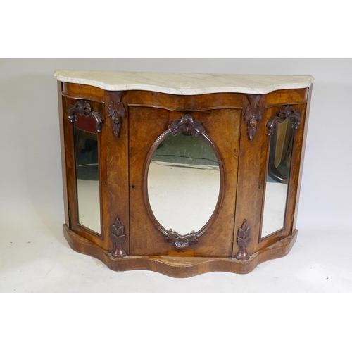 1020 - A Victorian mirror back chiffonier, the serpentine shaped base with Carrera marble top over three ar... 