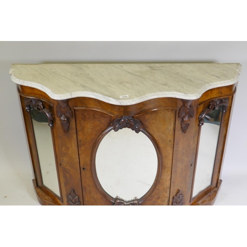 1020 - A Victorian mirror back chiffonier, the serpentine shaped base with Carrera marble top over three ar... 