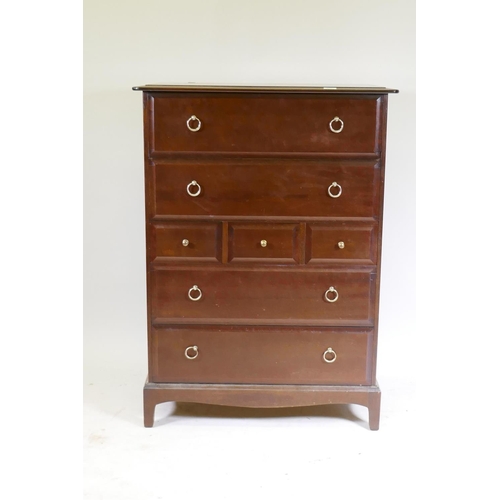 1021 - A Stag Minstrel tallboy chest of seven drawers, raised on square supports, 83 x 47 x 113cm