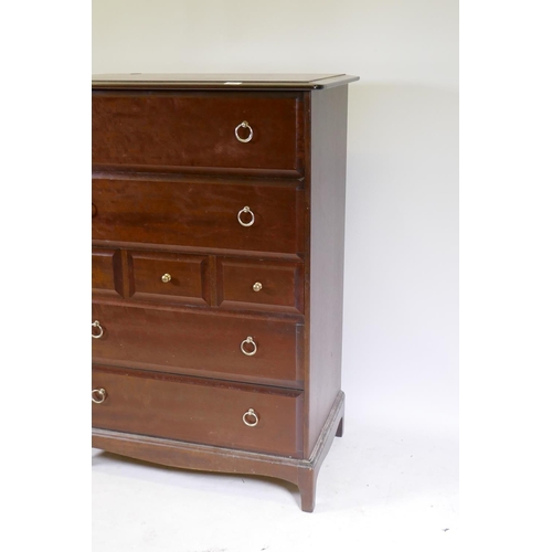 1021 - A Stag Minstrel tallboy chest of seven drawers, raised on square supports, 83 x 47 x 113cm