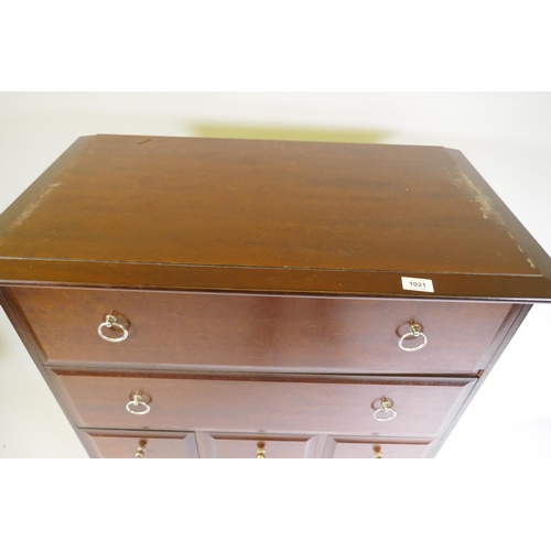 1021 - A Stag Minstrel tallboy chest of seven drawers, raised on square supports, 83 x 47 x 113cm