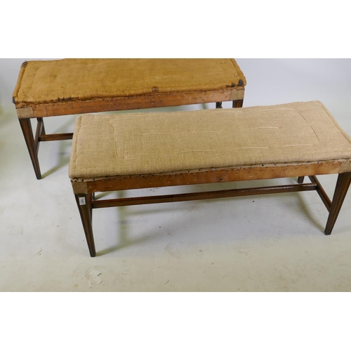 1023 - A pair of C19th oak country house window seats, raised on moulded tapering supports, united by H str... 