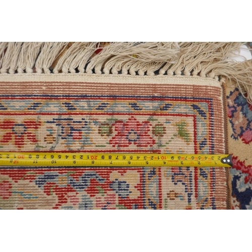 1025 - An English yellow ground hand knotted pile, country house carpet, probably Axminster, first half C20... 