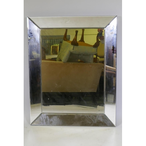 1028 - A contemporary sectional glass wall mirror, 94 x 75cm