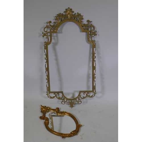 1030 - A pierced brass mirror frame, 90 x 47cm, and an Italian gilt wall mirror