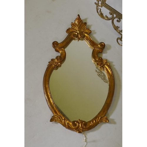 1030 - A pierced brass mirror frame, 90 x 47cm, and an Italian gilt wall mirror