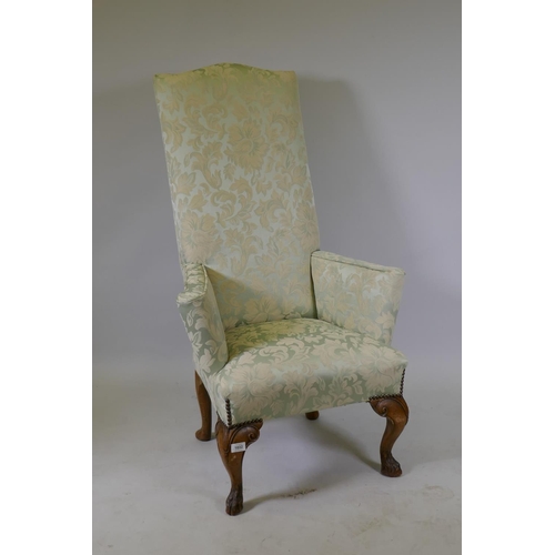 1032 - A Georgian style high back country house arm chair of small proportions, raised on carved cabriole s... 