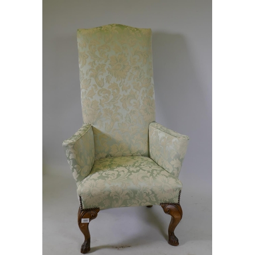 1032 - A Georgian style high back country house arm chair of small proportions, raised on carved cabriole s... 