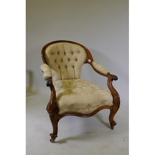 1033 - A Victorian faded rosewood open arm easy chair with carved decoration and serpentine shaped front, r... 