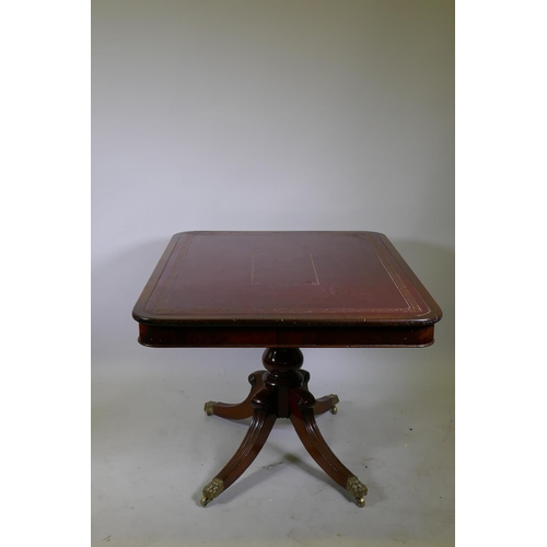 1034 - A Regency mahogany tilt top library/centre table with gilt tooled leather inset top, raised on turne... 