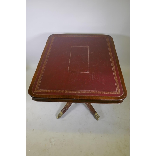 1034 - A Regency mahogany tilt top library/centre table with gilt tooled leather inset top, raised on turne... 