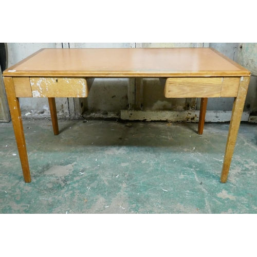 1037 - An oak two drawer desk with detachable legs, 140 x 76 x 76cm