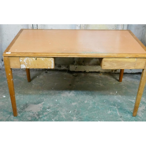 1037 - An oak two drawer desk with detachable legs, 140 x 76 x 76cm