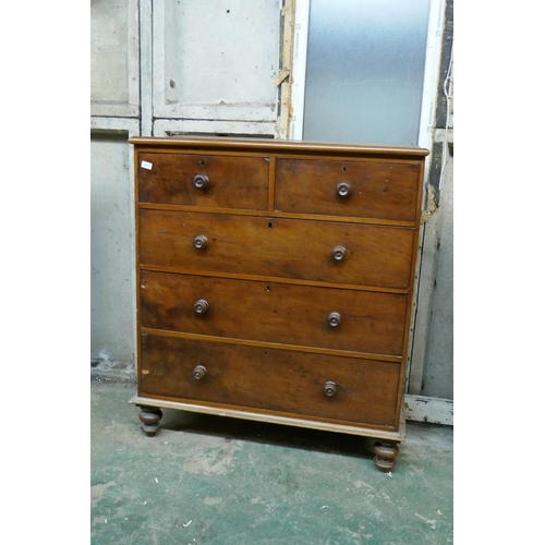 1041 - A Victorian mahogany chest of two over three drawers with original turned wood handles, raised on tu... 