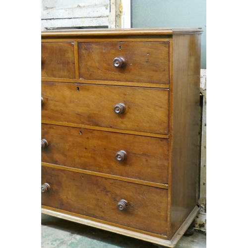 1041 - A Victorian mahogany chest of two over three drawers with original turned wood handles, raised on tu... 