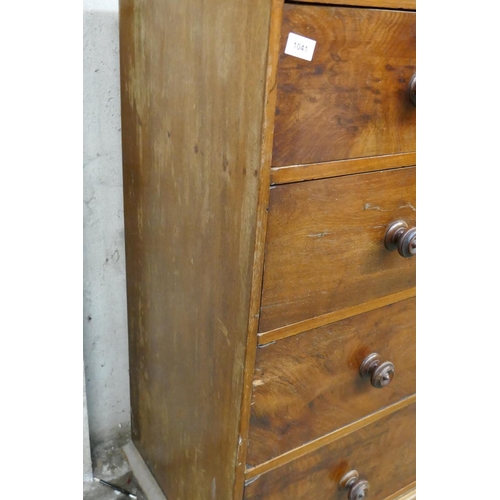 1041 - A Victorian mahogany chest of two over three drawers with original turned wood handles, raised on tu... 