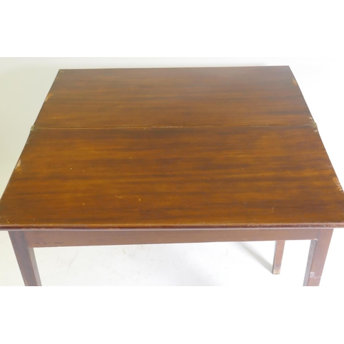 1044 - A C19th mahogany tea table with fold over top, raised on square tapering supports, 89 x 45 x 73cm