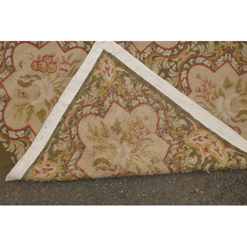 1046 - A Victorian beige and olive ground English needlepoint tapestry with floral design, 330 x 275cm