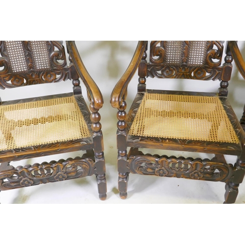 1055 - A set of two plus six walnut William and Mary style chairs with carved and pierced backs flanked by ... 