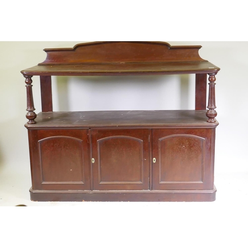 1059 - Victorian mahogany two tier buffet with shaped back and fluted columns over three cupboard with arch... 