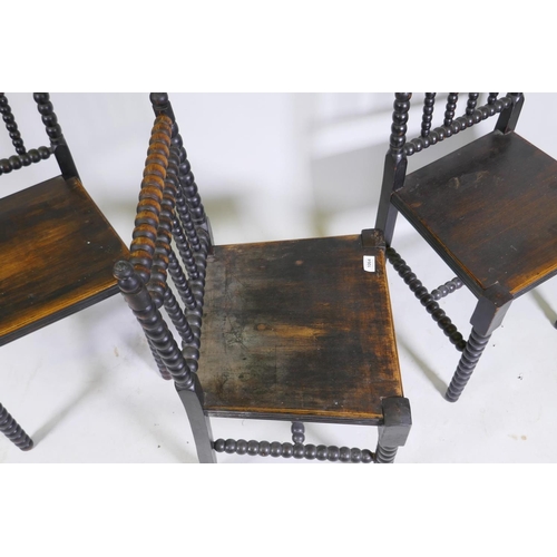 1064 - A set of three C19th bobbin turned side chairs