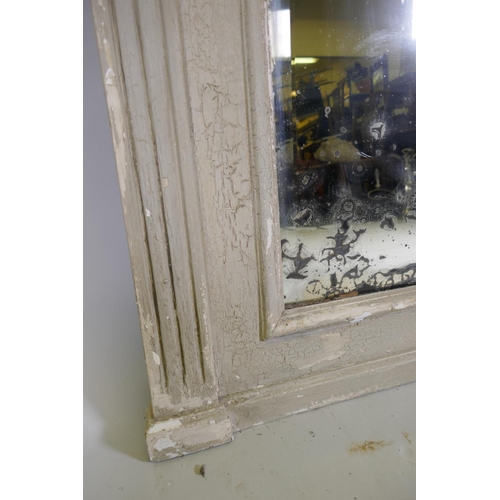 1068 - A C19th French wall mirror with distressed painted frame and antique bevelled edge glass, 104 x 160c... 