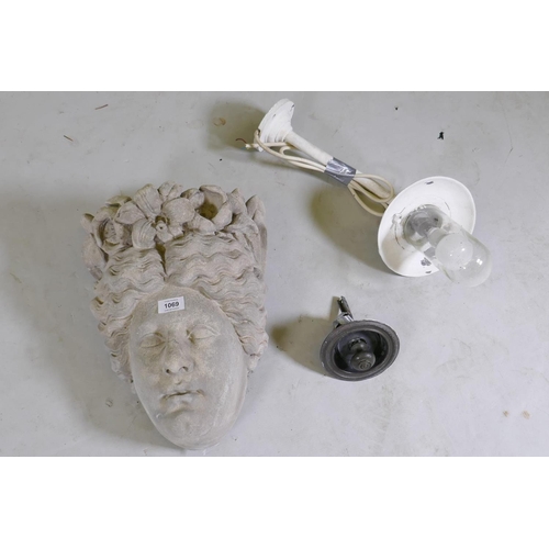 1069 - A reconstituted stone mask in the form of the head of Flora, 40cm high, a vintage metal exterior&nbs... 