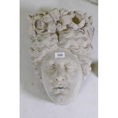 1069 - A reconstituted stone mask in the form of the head of Flora, 40cm high, a vintage metal exterior&nbs... 