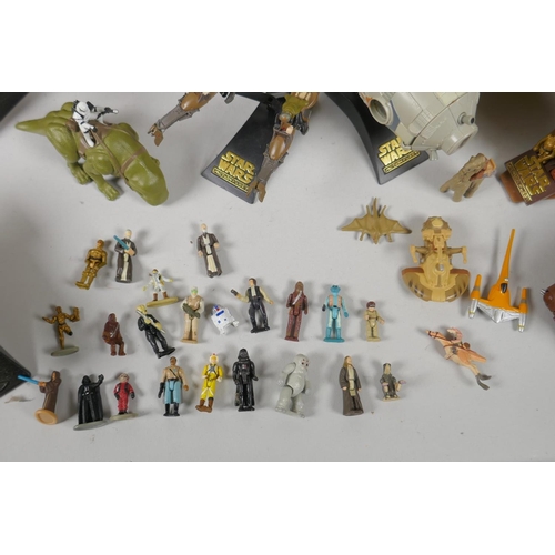 109 - A quantity of 90s Star Wars Micro Machines play sets and vehicles, to include the Millenium Falcon, ... 