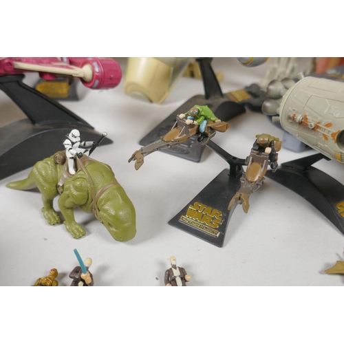 109 - A quantity of 90s Star Wars Micro Machines play sets and vehicles, to include the Millenium Falcon, ... 