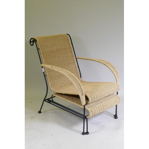 1091 - A contemporary sea grass open arm easy chair on a metal frame, with pull out foot stool