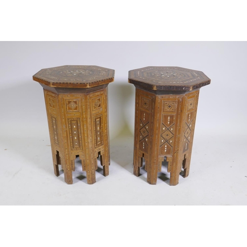 1092 - A pair of Moorish marquetry inlaid octagonal occasional tables, 55cm high, 40cm diameter