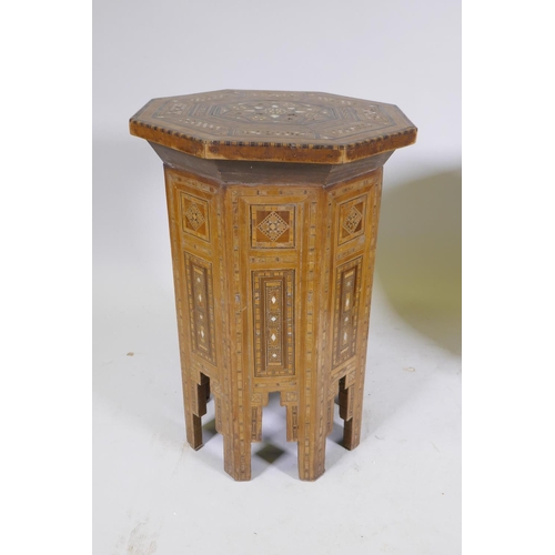 1092 - A pair of Moorish marquetry inlaid octagonal occasional tables, 55cm high, 40cm diameter