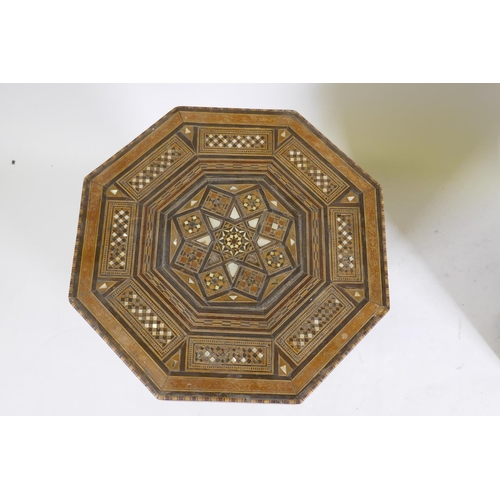 1092 - A pair of Moorish marquetry inlaid octagonal occasional tables, 55cm high, 40cm diameter