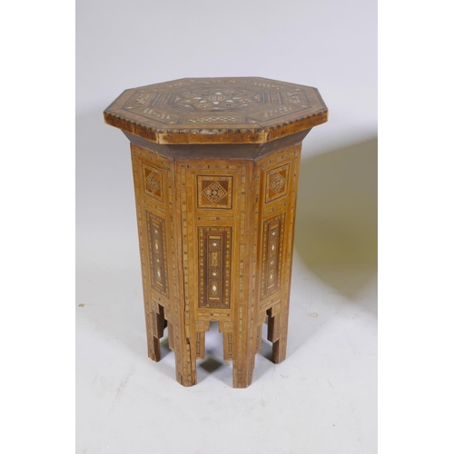 1092 - A pair of Moorish marquetry inlaid octagonal occasional tables, 55cm high, 40cm diameter