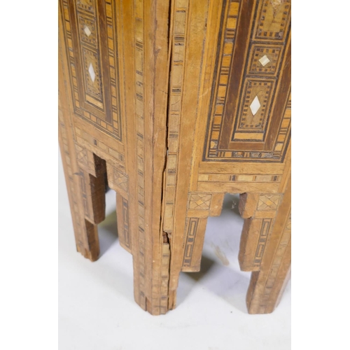 1092 - A pair of Moorish marquetry inlaid octagonal occasional tables, 55cm high, 40cm diameter