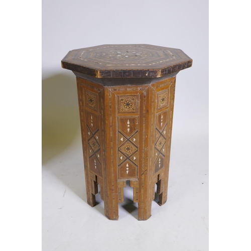 1092 - A pair of Moorish marquetry inlaid octagonal occasional tables, 55cm high, 40cm diameter