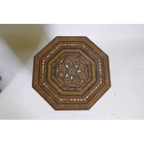 1092 - A pair of Moorish marquetry inlaid octagonal occasional tables, 55cm high, 40cm diameter