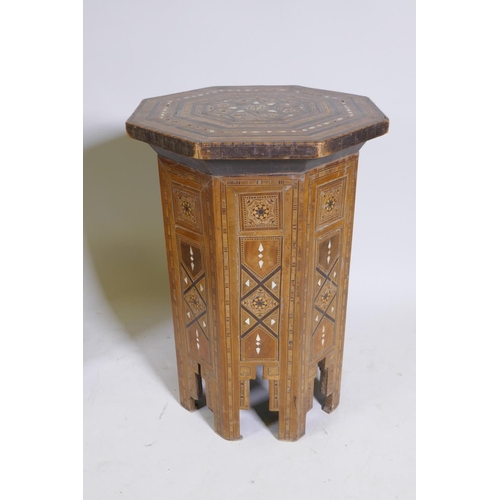 1092 - A pair of Moorish marquetry inlaid octagonal occasional tables, 55cm high, 40cm diameter