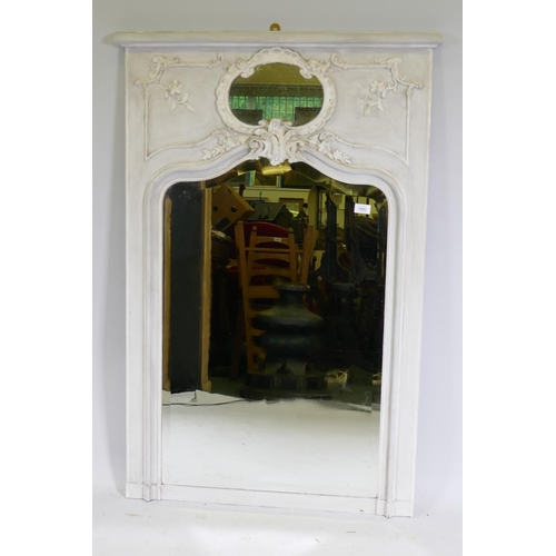 1093 - A C19th French trumeau wall mirror with moulded decoration, distressed paint and antique bevelled ed... 