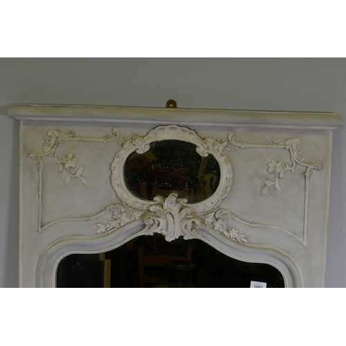 1093 - A C19th French trumeau wall mirror with moulded decoration, distressed paint and antique bevelled ed... 