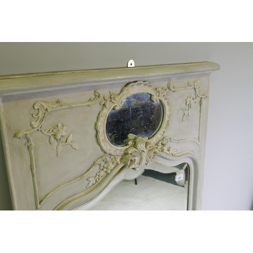 1093 - A C19th French trumeau wall mirror with moulded decoration, distressed paint and antique bevelled ed... 