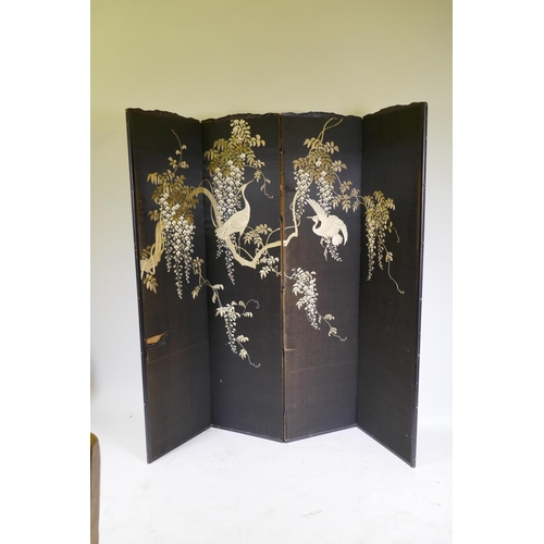 1095 - An oriental embroidered silk four fold screen in a lacquered wood frame, each panel 43 x 161cm