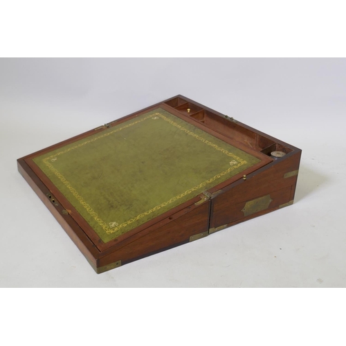 11 - A Victorian mahogany campaign writing slope with brass mounts, with leather inset interior, secret s... 