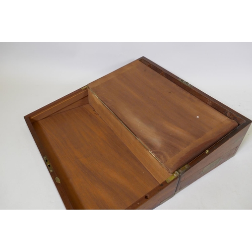 11 - A Victorian mahogany campaign writing slope with brass mounts, with leather inset interior, secret s... 